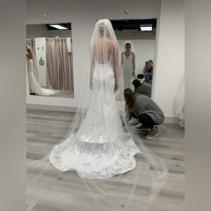 Never wore Lara dress. Off the shoulder sleeves were removed.